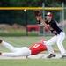 Coldwater High School baserunner, freshman Austin Krzeminski beats the throw and Milan High School first baseman, senior Evan Peacock to the bad during the fifth inning of the MHSAA baseball quarterfinals at Nichols Field at Bailey Park in Battle Creek on Tuesday, June 11, 2013. Melanie Maxwell | AnnArbor.com